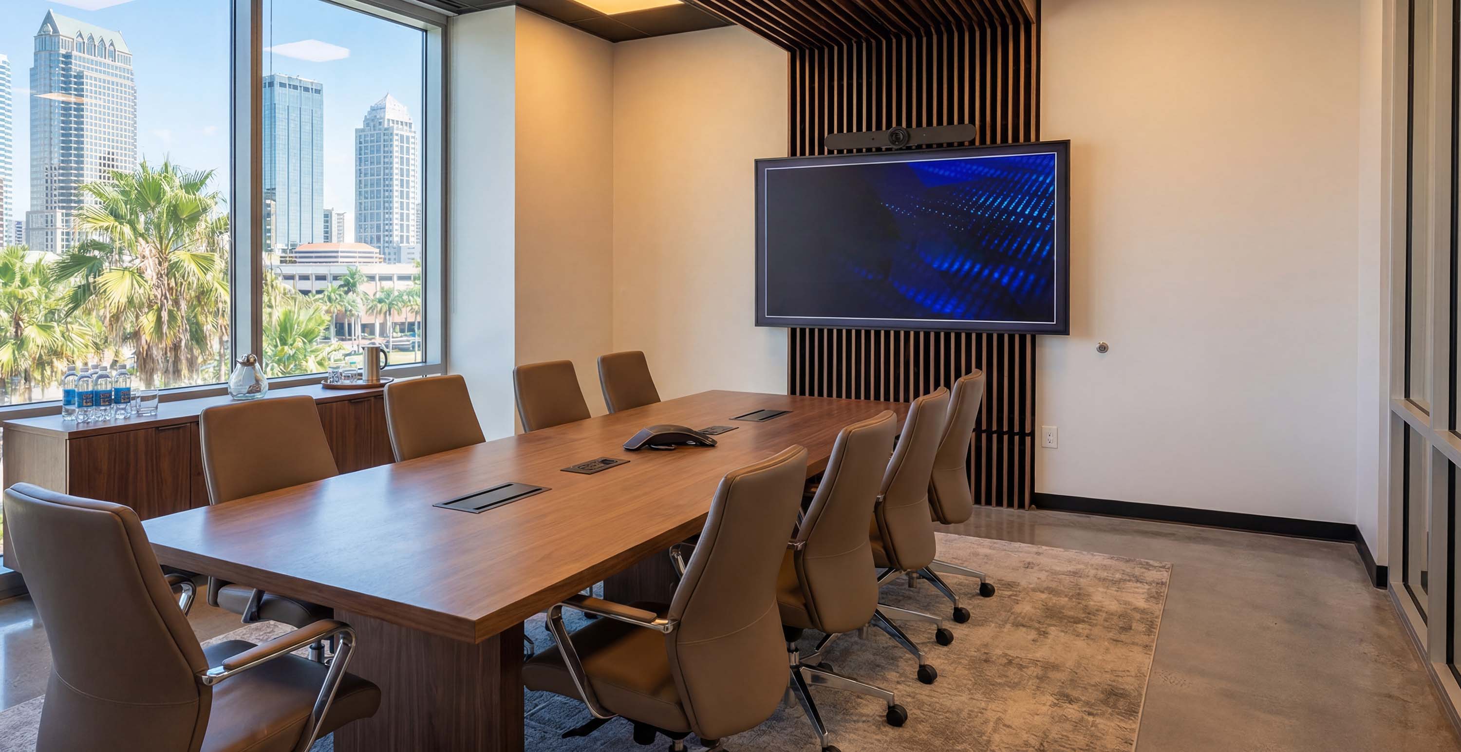 conference room with lighting and tv on the wall