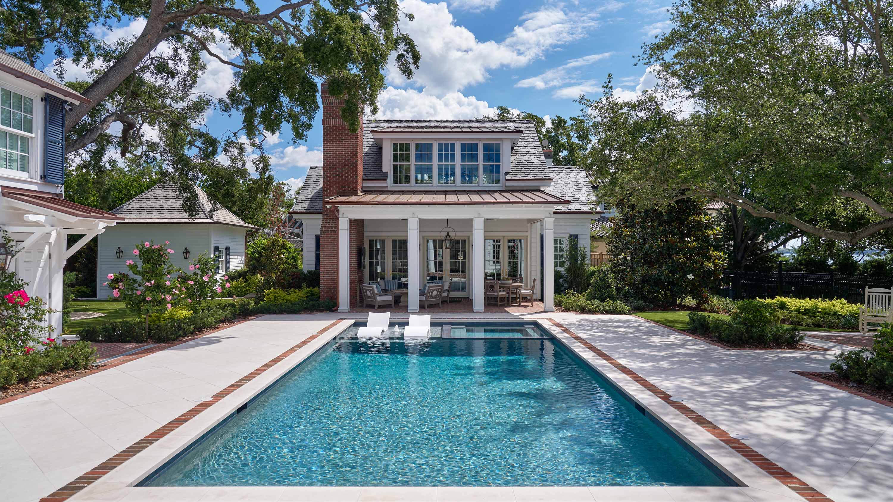 outdoor space with a pool and TV