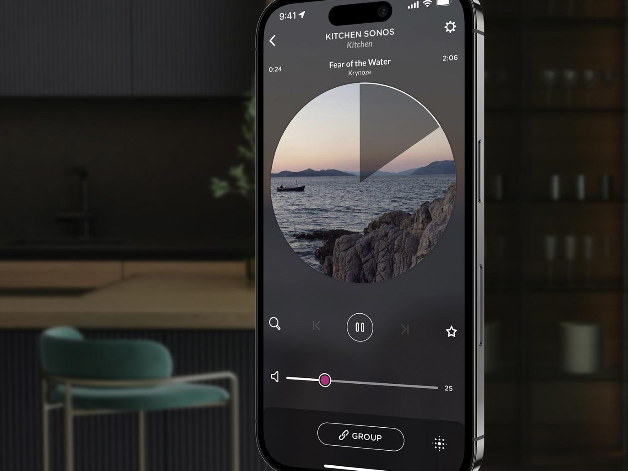 A smartphone displaying the Josh AI music player interface with a song playing, set against a modern kitchen background with sleek design elements.